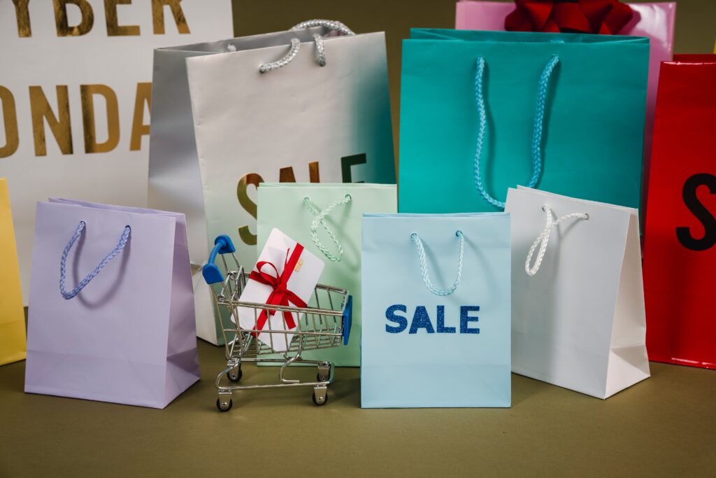 multiple shopping bags and a gift card